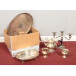 A box of assorted silver plate. Serving trays, Candelabra, coffee pot etc