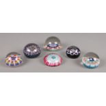 Six glass paperweights, with millefleur design.