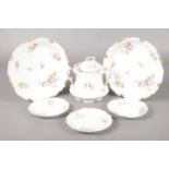 Six pieces of Limoges ceramics, decorated in floral patterns. To include two serving bowls, lidded