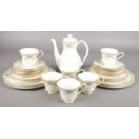 A collection of Royal Doulton Juliet pattern bone china tea and dinnerwares.