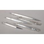 Five silver propelling pencils/pencil holders.