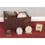 A box of mostly alarm clocks. Westclox Baby Ben, Smiths etc