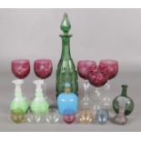 A collection of mainly coloured glassware. Includes green glass decanter, hock glasses, scent bottle