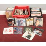 Three boxes of 45 rpm vinyl records. Paul Young, The Nolans, Shakin Stevens, Shirley Bassey,