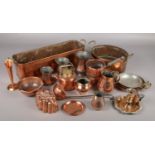 A good collection of metalwares. Includes antique copper measures and jugs, chamber stick, mould