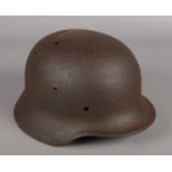 A German Third Reich WWII helmet.
