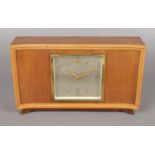 A walnut Elliot manual mantel clock.