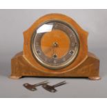 A Bentima wooden mantle clock. Comprising of a Perivale movement stamped inside. To include spring