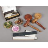 A quantity of collectables. Includes pot lids, wooden gavels, slide ruler etc.