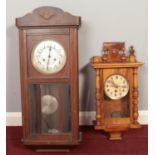 Two Mahogany cased pendulum wall clocks.