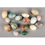 A collection of decorative eggs. Includes malachite and hardstone examples.