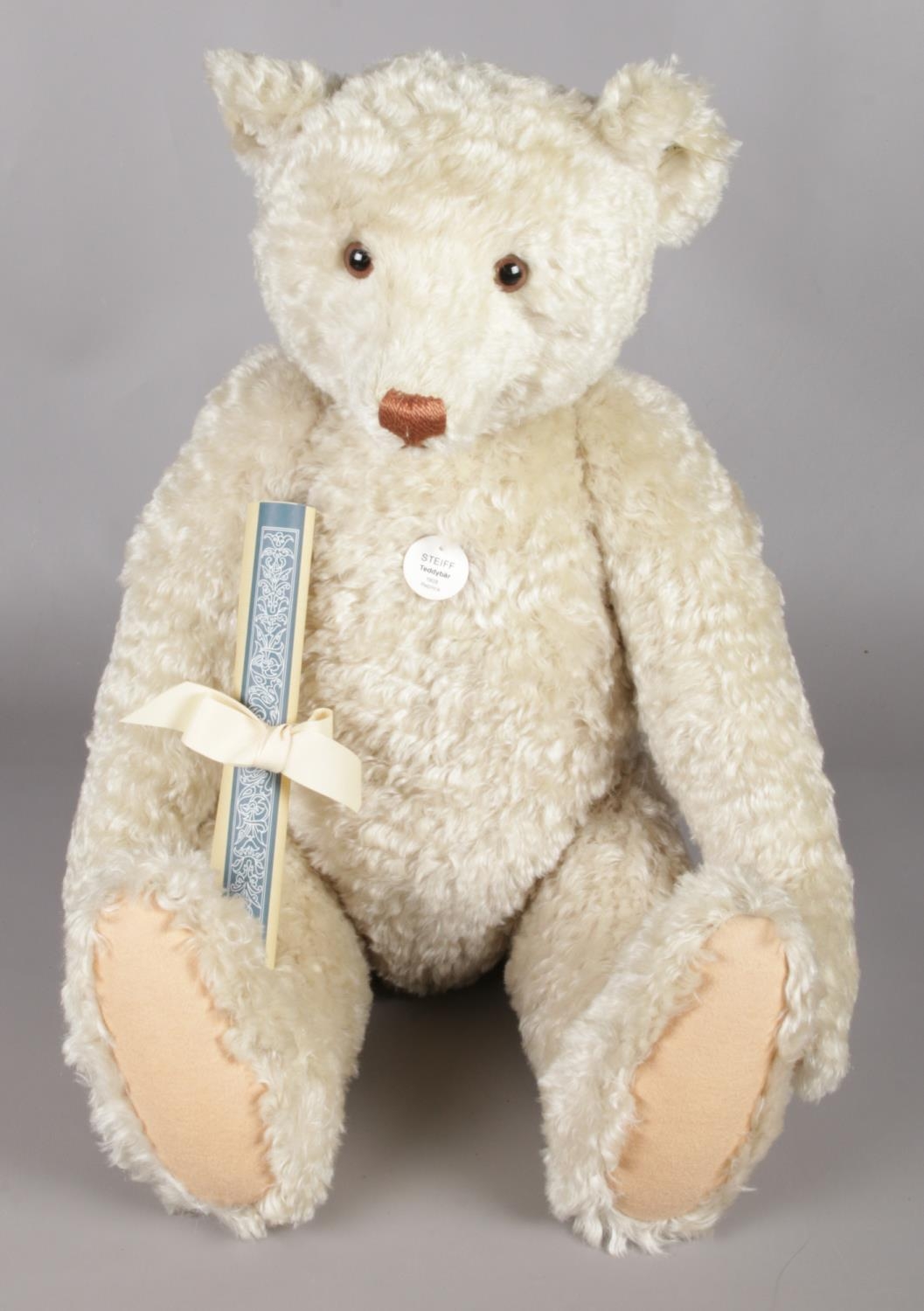 A Steiff limited edition 1994 Replica Teddy Bear 1908 white, 2033 of 7000 worldwide. Gold button