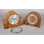 A carved oak Haller mantel clock along with another walnut mantel clock.