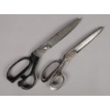Two pairs of vintage metal tailors scissors.