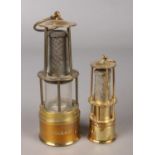 Two D&P miniature miners lamps. Both bearing the German word Gluckauf. Heights 15cm and 10cm.