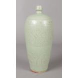 A Chinese Meiping Celadon Vase, with foliate decoration. Height: 22cm. Markings to the base.