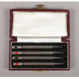 A cased set of four sterling silver bridge propelling pencils in original case.