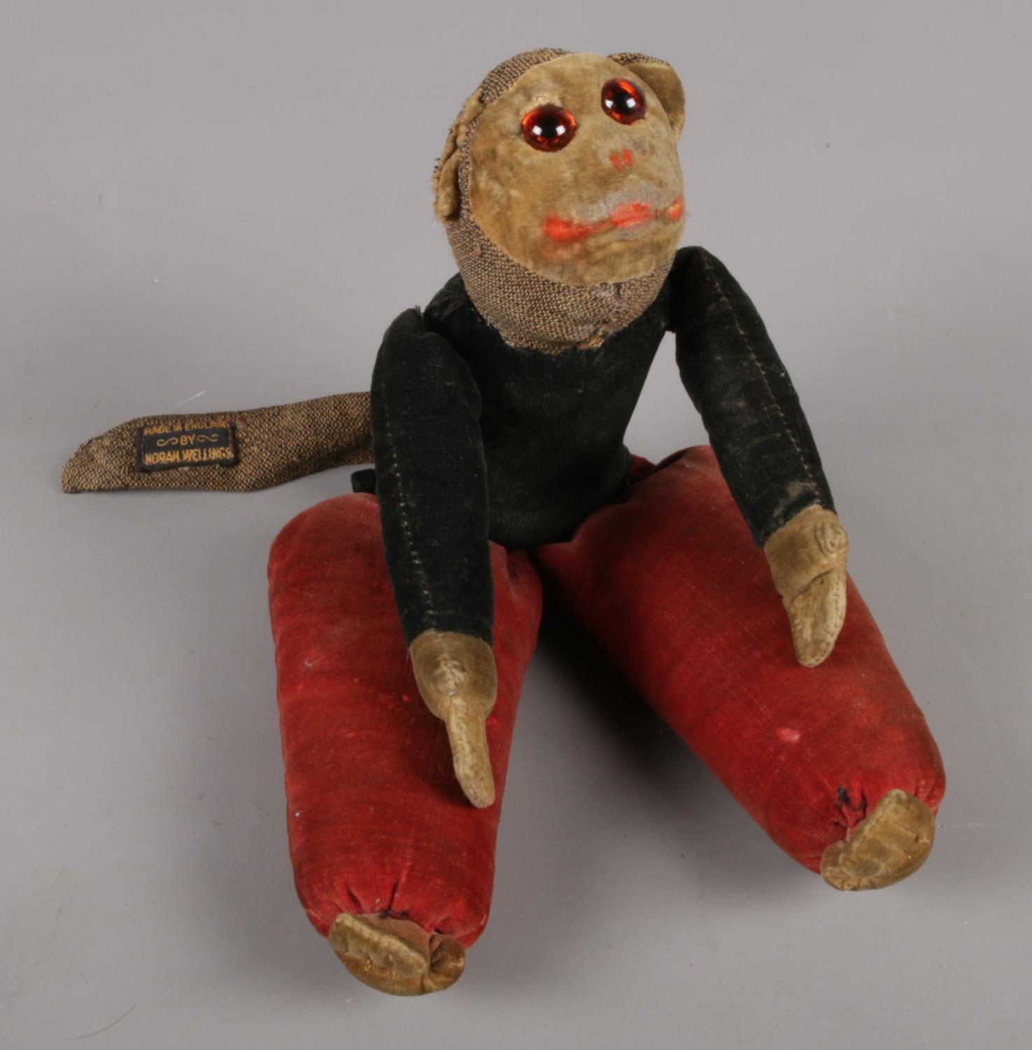 An antique monkey doll by Norah Wellings.