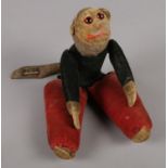 An antique monkey doll by Norah Wellings.