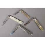 Four silver bladed fruit knives. Includes mother of pearl examples.