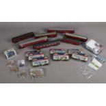 A box of assorted 00 gauge carriages and boxed figures etc. To include seven carriage (Hornby,