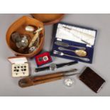 A collar box with contents of collectables. Includes large compass, vintage spectacles, sovereign