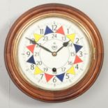 A reproduction fusee wall clock, bearing the RAF insignia logo. Dial diameter: 20cm.
