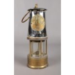 An Eccles CR6S miners safety lamp, made by the Protector Lamp & Lighting Company Ltd. H: 24.5cm.