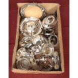A box of silver plated items. Includes wine coasters, Walker & Hall tea set, Mappin & Webb
