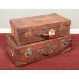 Two large vintage leather suitcases. Includes on bearing labels for the Ropner Line and French Line.