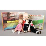Two vintage games with four vintage dolls. To include Waddington's 'Mine-a-million' & 'Escalado'