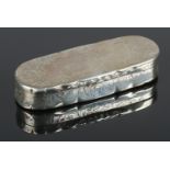 A Victorian silver pill box, embossed with scroll and floral decoration. Assayed for Birmingham,