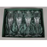 A boxed set of four quality Thomas Webb lead crystal champagne flutes.