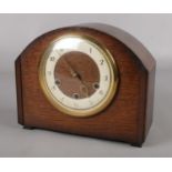 A Smiths oak cased mantel clock. Westminster chiming.