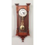 A Highlands mahogany cased pendulum wall clock.