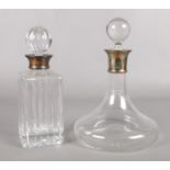 Two glass and crystal decanters with stoppers. To include stamped and hallmarked sterling silver