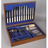 An oak canteen of Harrison Bros & Howson silver plated cutlery.