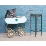 A child's vintage metal pram and a black painted metal plant stand. Stand: H:51cm, W: 19cm. Pram: