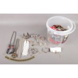 A large tub of assorted costume jewellery. To include rings, bracelets, necklaces and earrings etc.