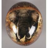 A South African decorated ostrich egg. Depicting Elephants.