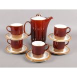 A Poole part coffee set. To include hot water jug, cups and saucers.