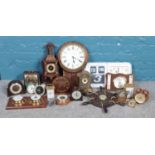 A large quantity of clocks and barometers. To include Acctim 'Flip' wall clock, H. Samuel alarm