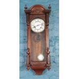 A Mahogany eight day cased pendulum wall clock. (86cm height 30cm width)