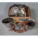 A box of assorted metal and wooden wares. Includes wine coolers, animal figures etc.