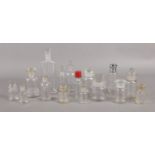 A good quantity of glass perfume and medicine bottles. To include screw cap and stopper examples,