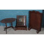 A mahogany fire screen along with a mahogany occasional table and a toilet mirror.