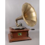 A 'His Masters Voice' Wind Up Gramophone. Comes with brass horn and winder. In need of restoration