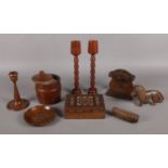 A selection of assorted treen. To include an inlayed mother of pearl trinket box, a pair of turned