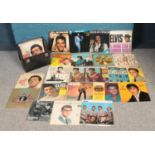 A carry case with vinyl records. To include a large collection of Elvis Presley, Buddy Holly and The