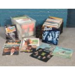Two boxes of assorted LP vinyl records. To include artists, The Police, Simon & Garfunkel,